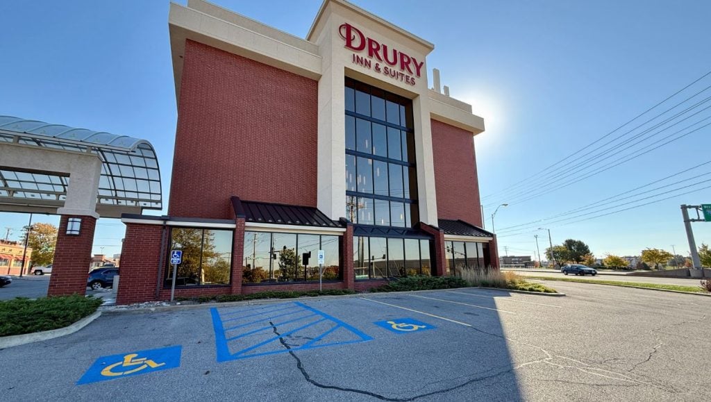 front view of Drury Inn & Suites with freshly painted ada compliance parking spots