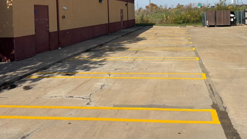 yellow line markings freshly painted for Drury Inn & Suites parking lot