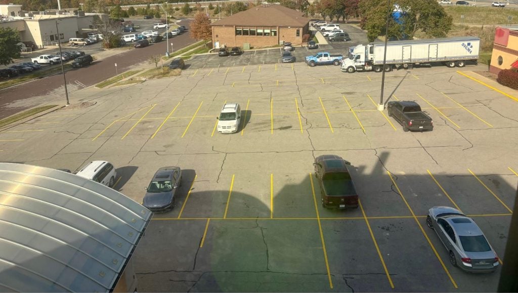 aerial view of Drury Inn & Suites parking lot freshly painted