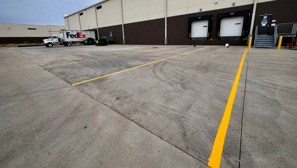 yellow line striping freshly painted for Rexel USA