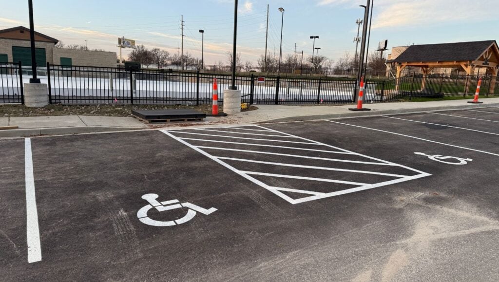ada compliance parking spots close-up freshly painted for Meadows Park and Ice Rink