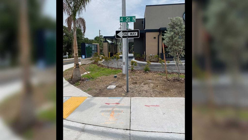 a “one-way” sign in the grass