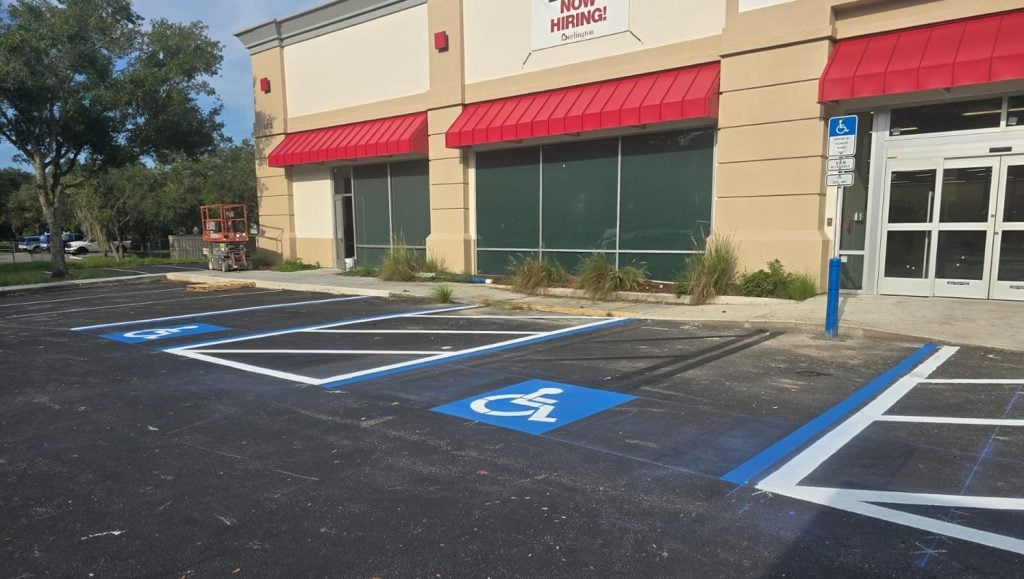 Burlington parking lot with freshly painted ada compliance parking spots