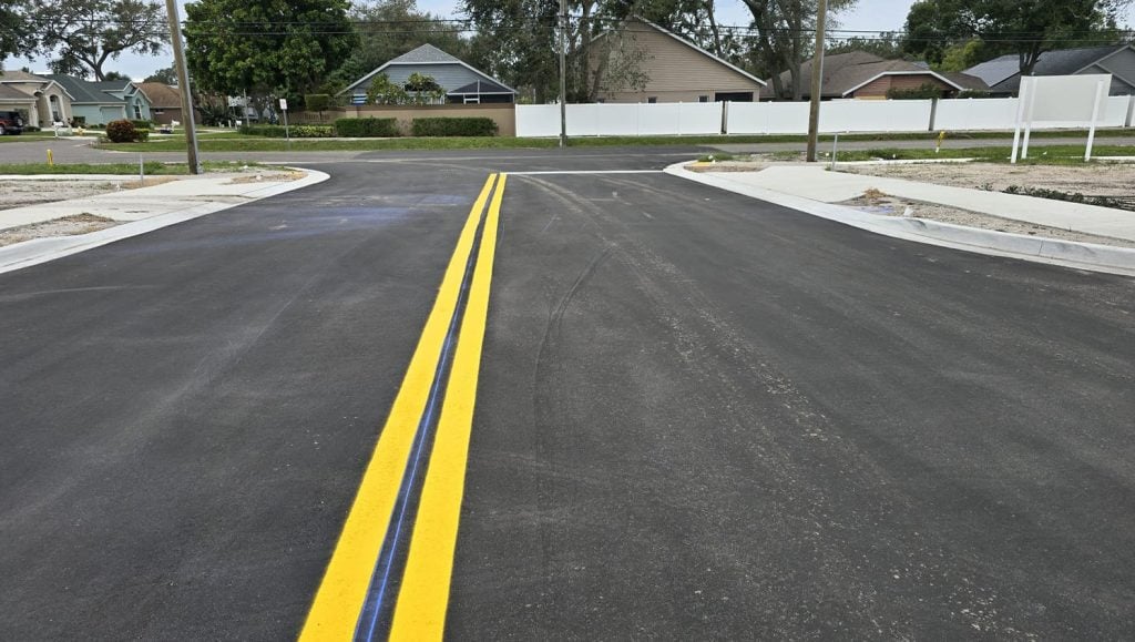 freshly painted yellow line markings for townhomes parking lot