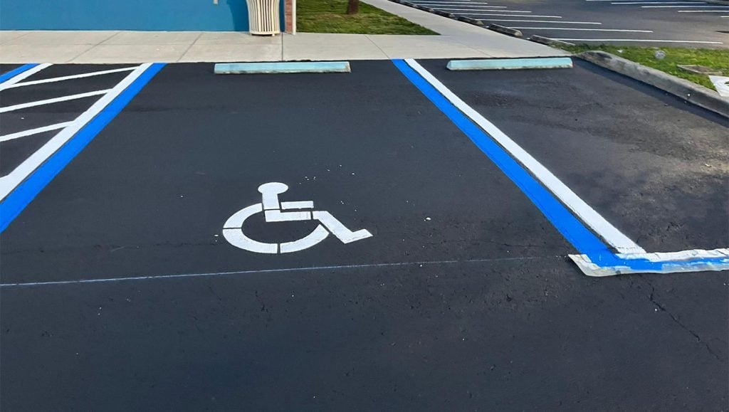 striping parking lot using greco striping machine