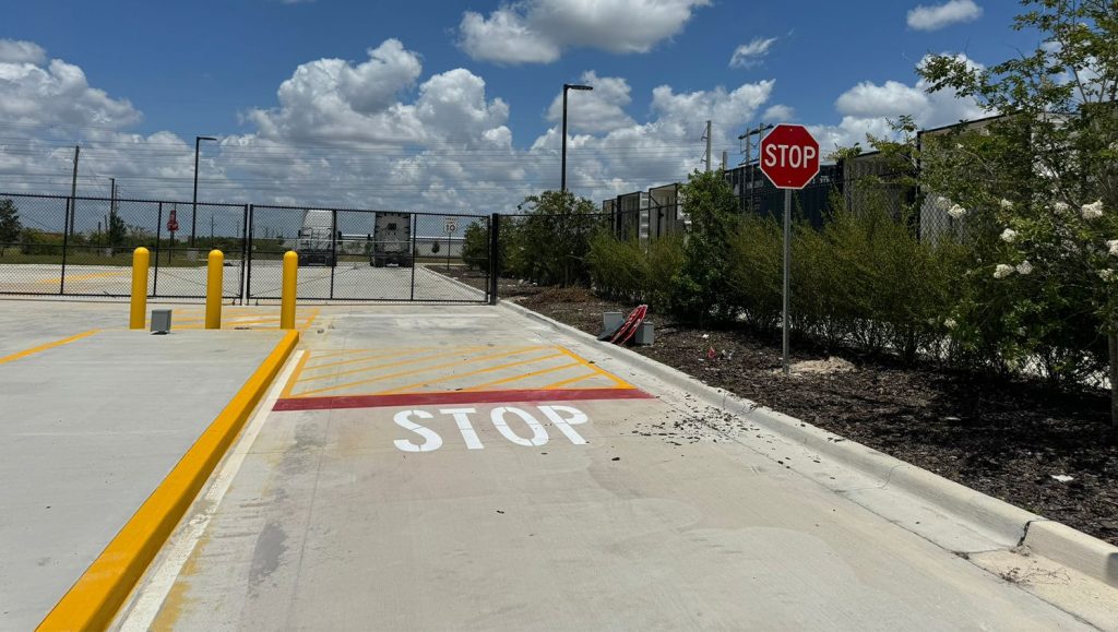 freshly painted yellow lines for amazon warehouse parking lot