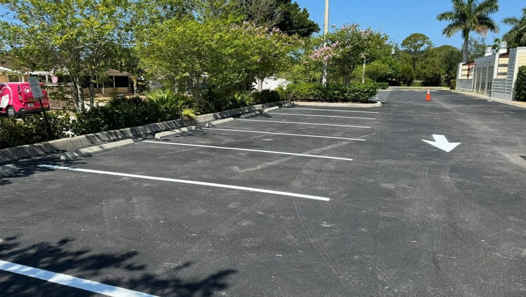 freshly painted arrows for apartment complex parking lot