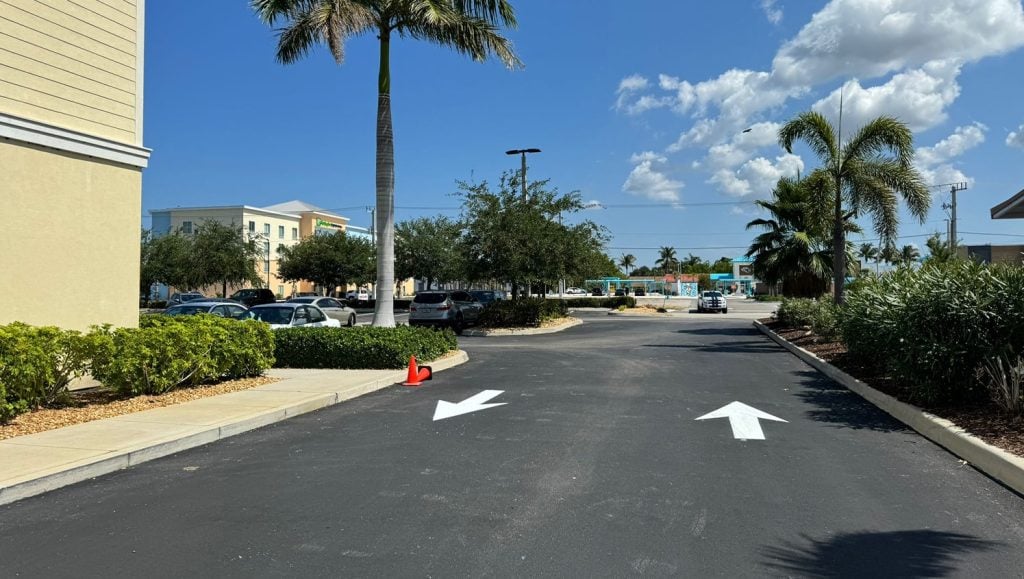 freshly painted arrows for apartment complex parking lot