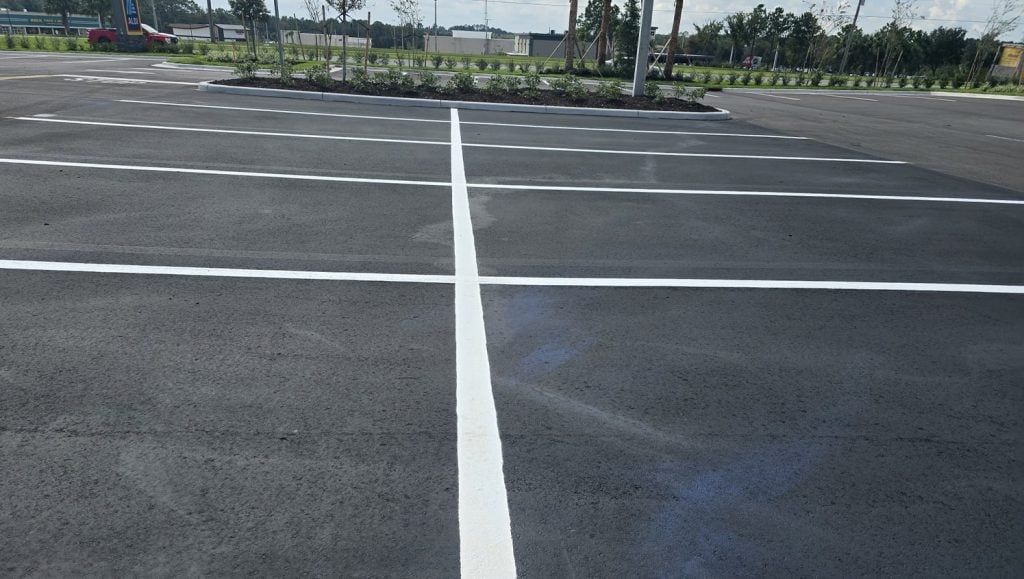 Aldi parking lot with freshly poured asphalt sealcoating