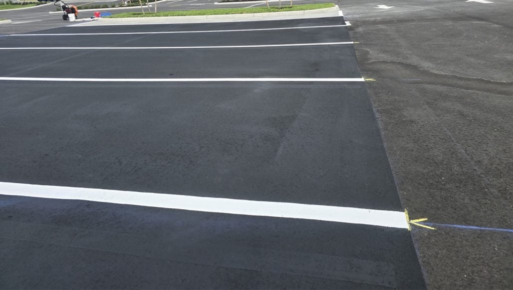 fresh asphalt sealcoating for Aldi parking lot