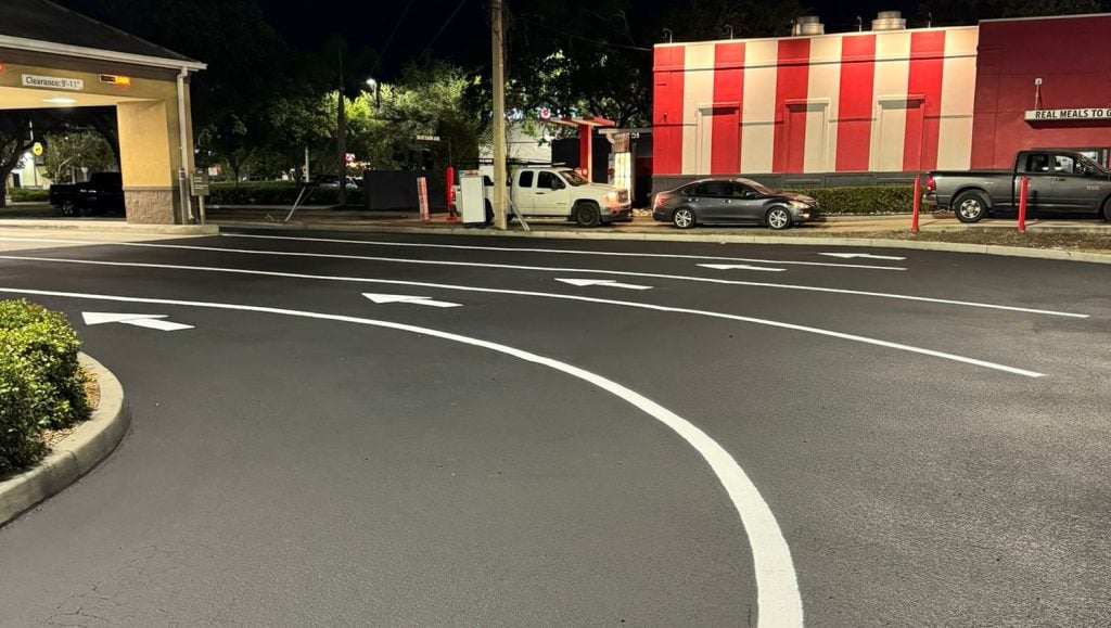 freshly painted lines and arrows for wells fargo parking lot