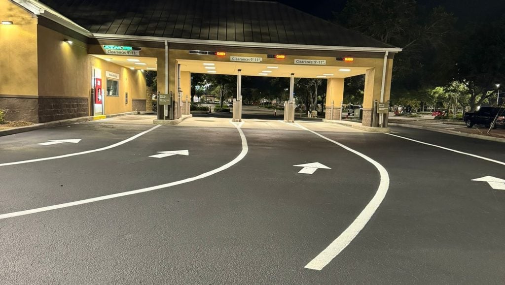 fresh asphalt and fresh line marking for crosswalk for wells fargo parking lot