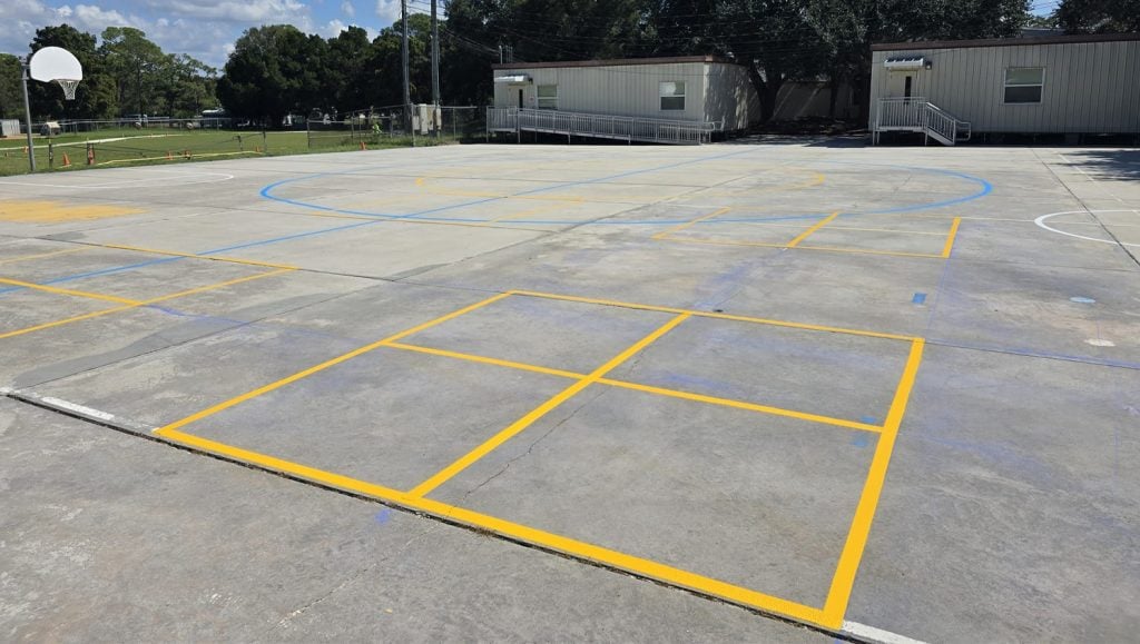 freshly painted yellow line markings for athletic field