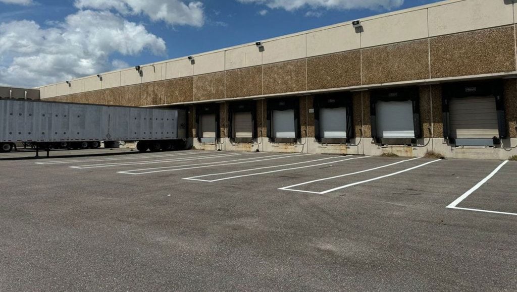 business parking lot marking project in business parking lot sealcoating project in Tampa, FL