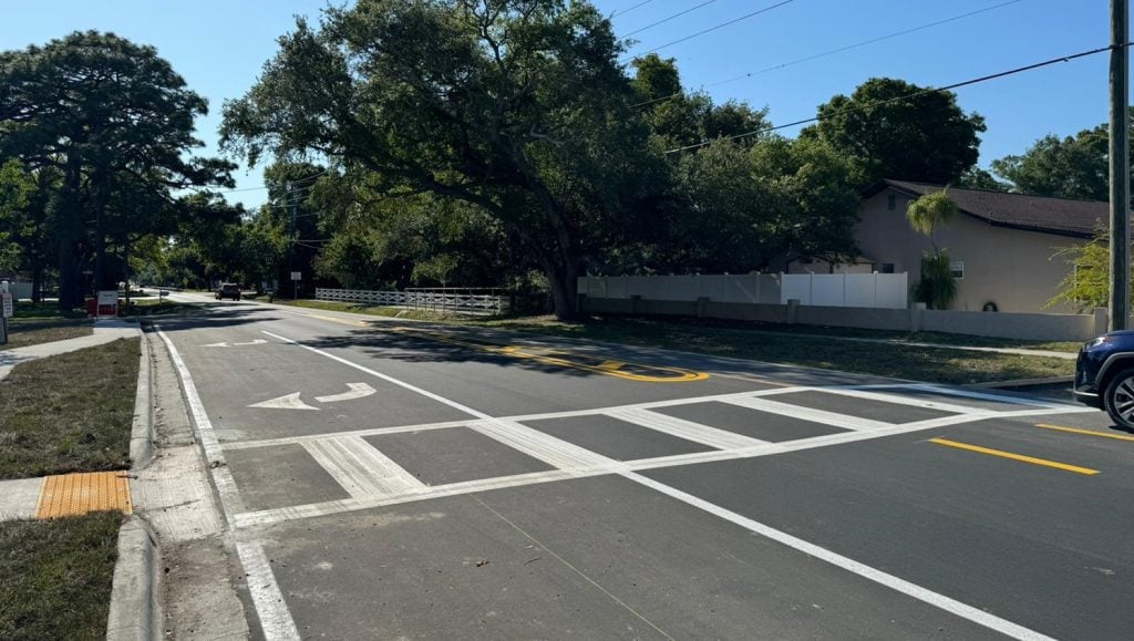 freshly painted white lines for cross walk
