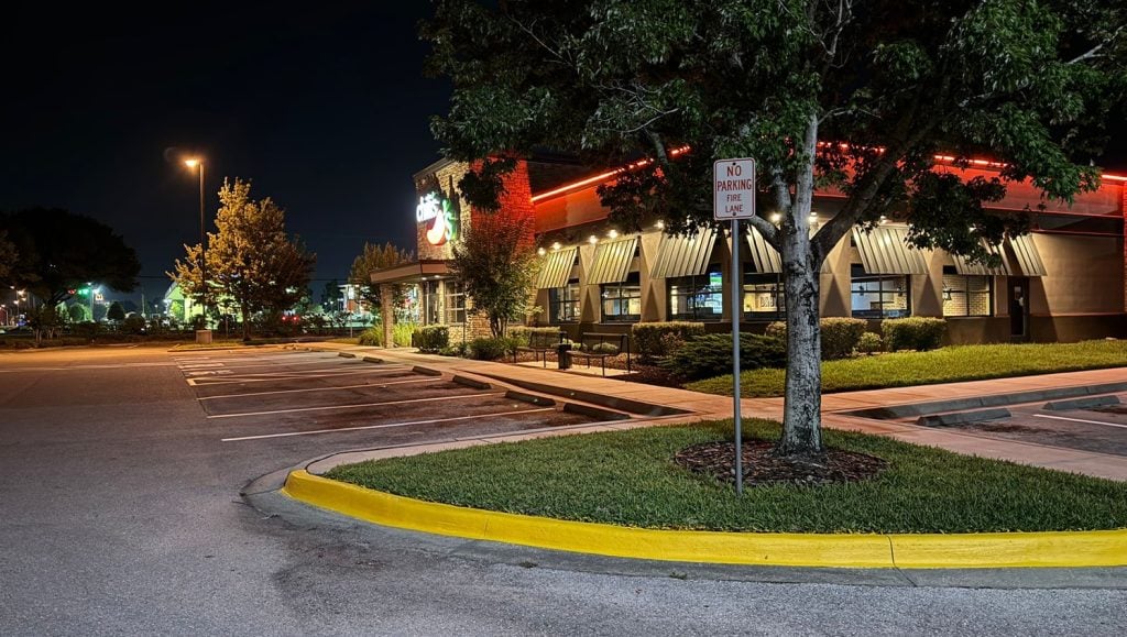 close-up of freshly painted yellow cross walk for chilis parking lot