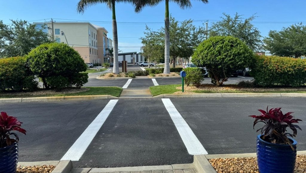 freshly painted lines in front of apartment complex