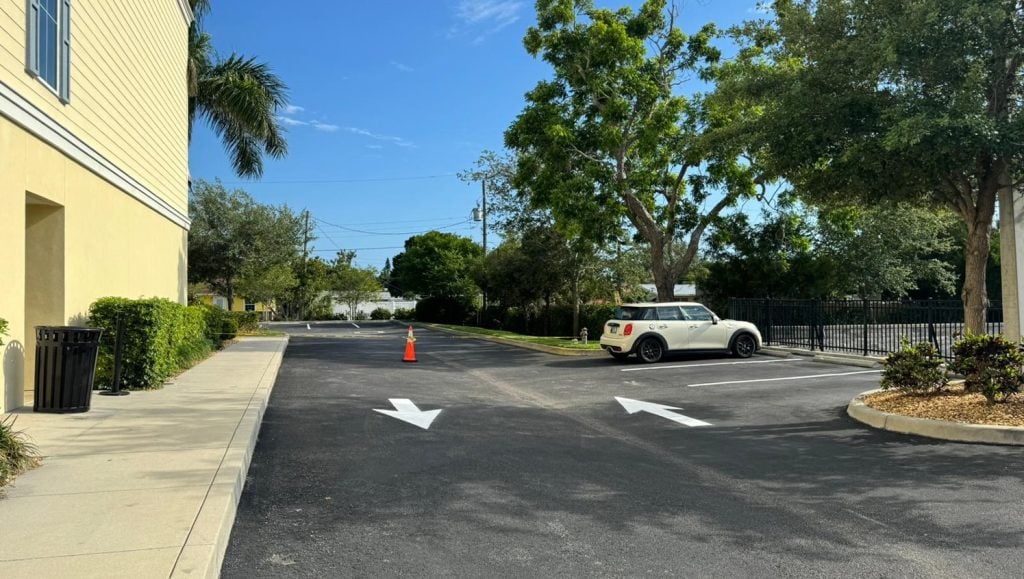 freshly painted arrows for apartment complex parking lot
