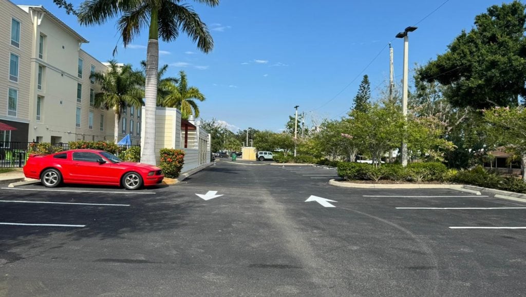 apartment complex parking lot with freshly painted arrows