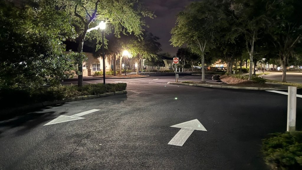 freshly painted white arrows on daycare parking lot