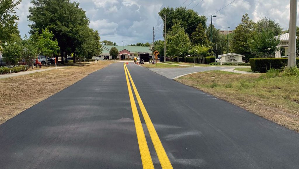 double yellow lines striping in the center of a newly paved road in Mt. Dora, FL