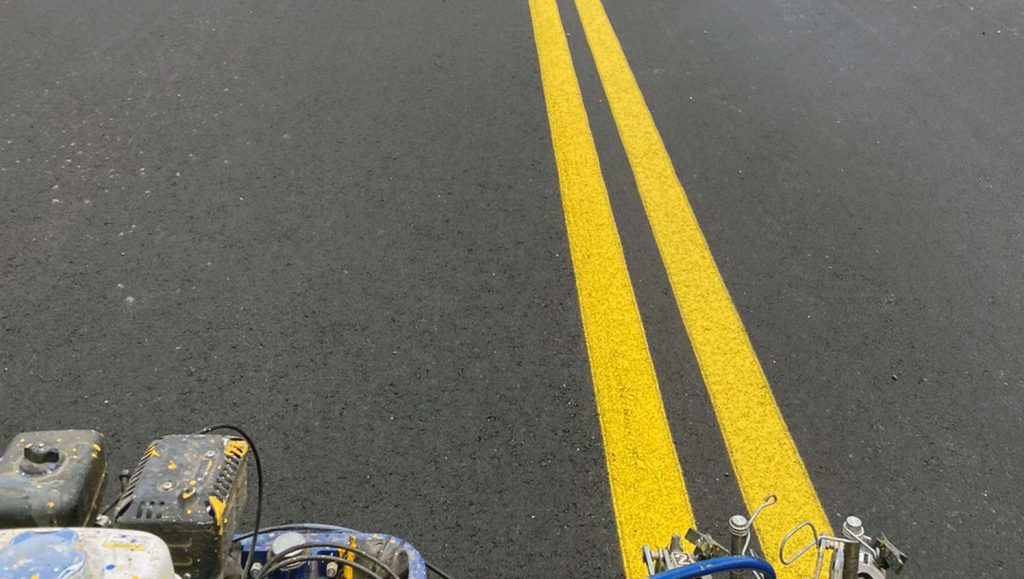double yellow lines striped in the center of a newly paved road in Mt. Dora, FL