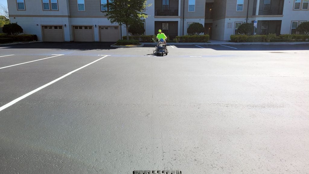 man using a striping machine