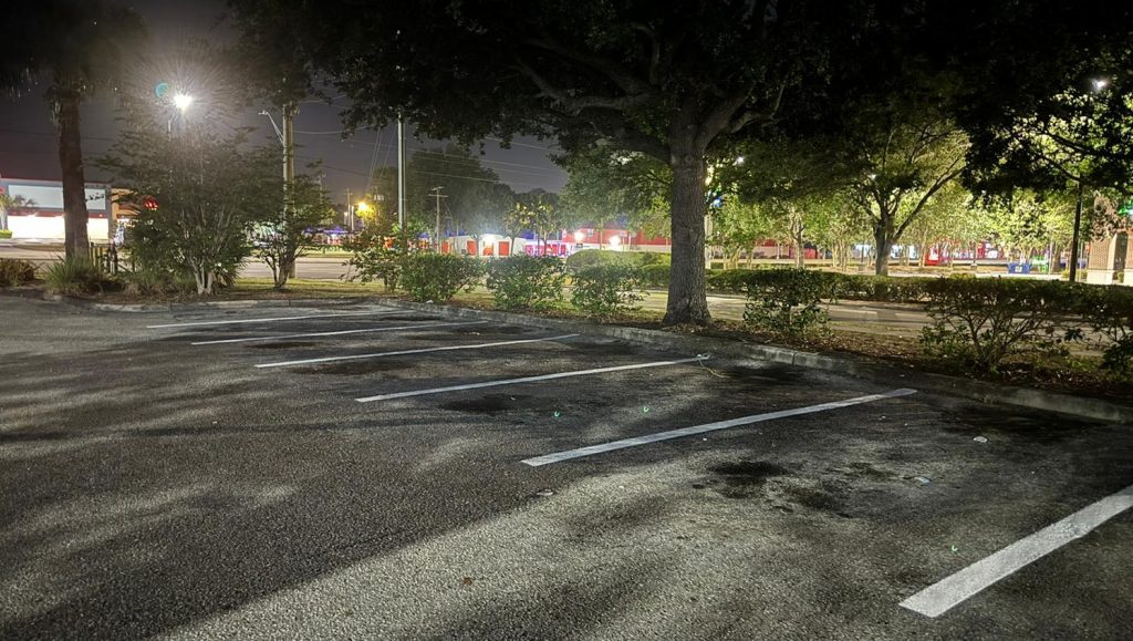 close-up of stop sign and fresh yellow lines at Goodwill parking lot