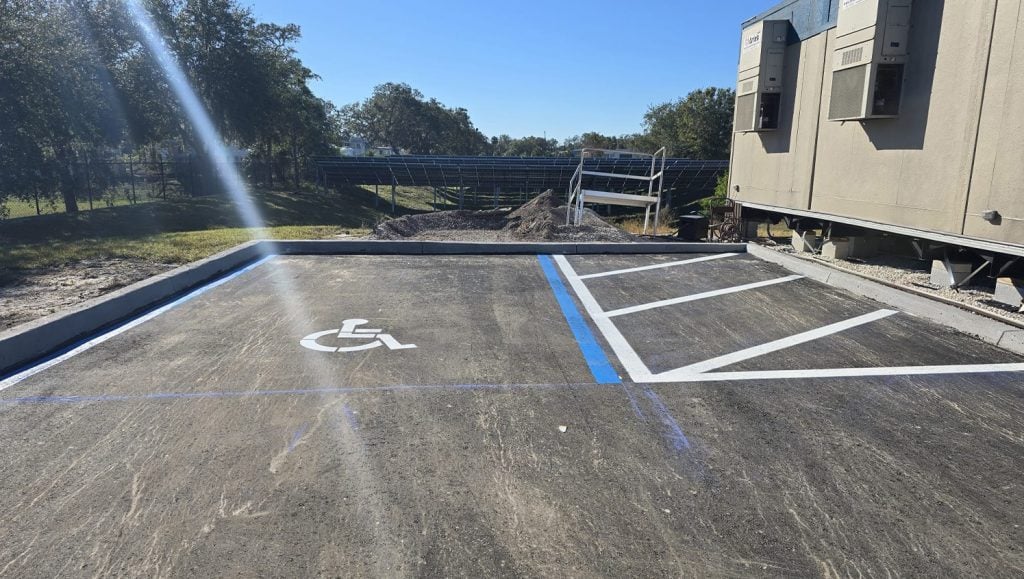 ada compliance parking spots freshly painted for business parking lot