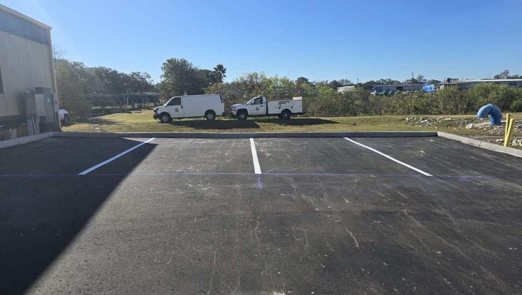 front view of parking spots freshly painted for business parking lot