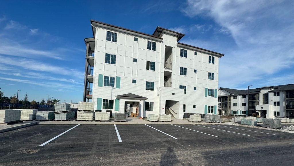 side view of Apartment Complex with freshly painted parking spots