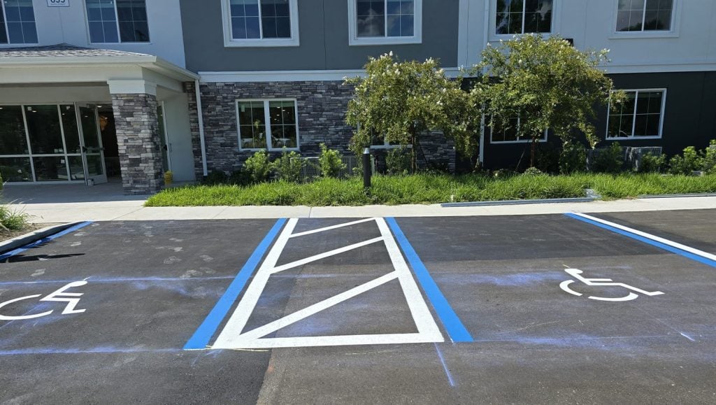 freshly painted ada compliance parking spots for apartment complex