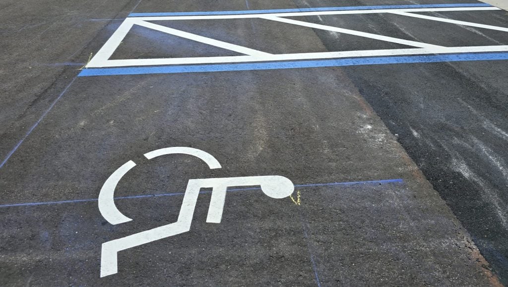 apartment complex parking lot with freshly painted line markings