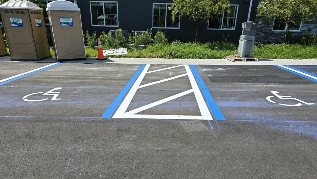 apartment complex parking lot with freshly painted line markings