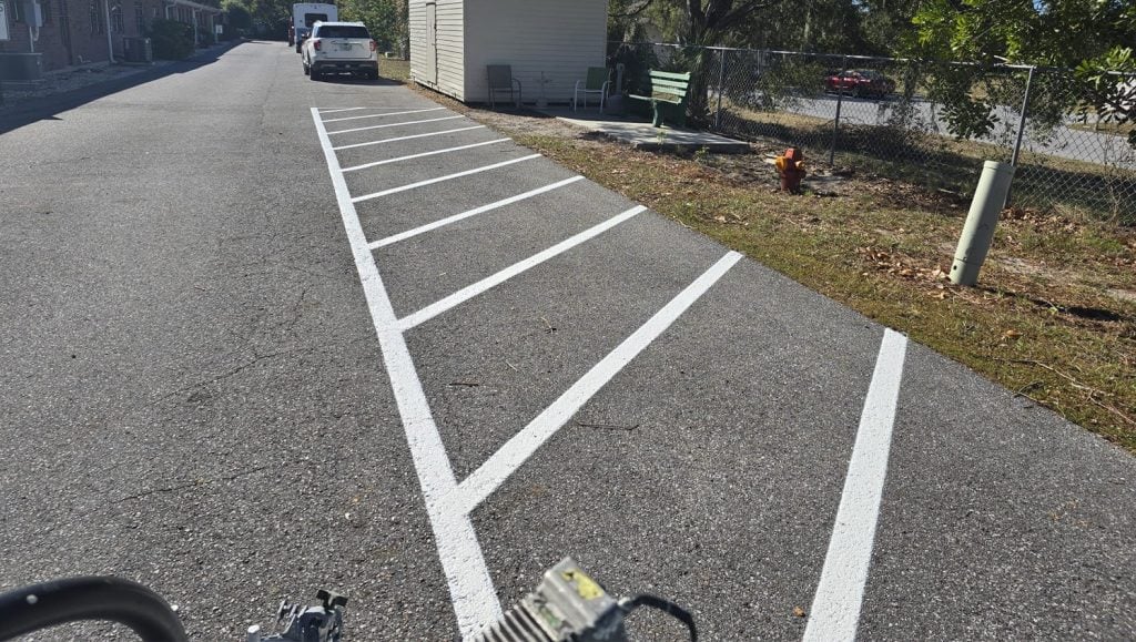 close-up of freshly painted line markings for apartment parking lot