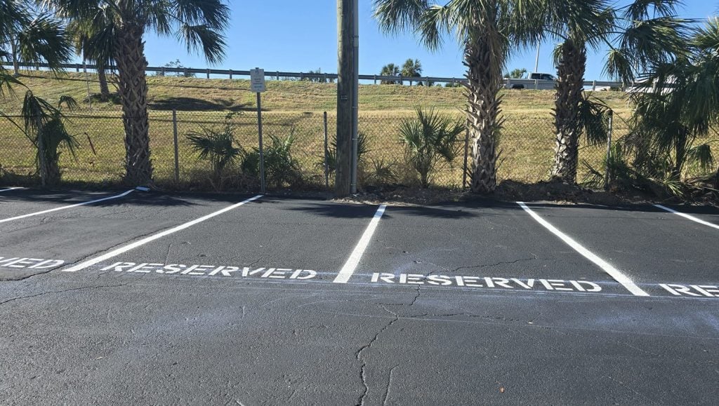 front view of freshly poured asphalt for business parking lot
