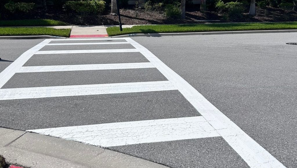 close-up of freshly painted cross walk on pavement