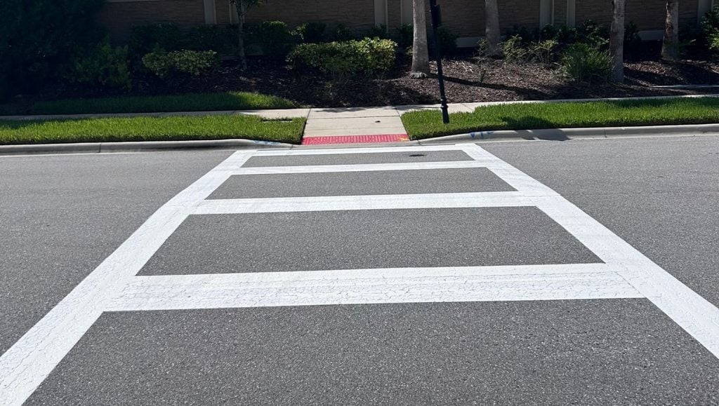 freshly painted crosswalk on pavement