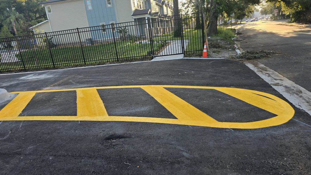 freshly painted yellow line markings for apartments