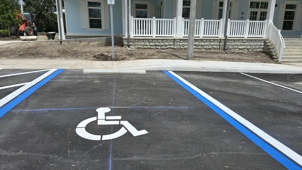 front view of business office with freshly painted ada compliance parking spots