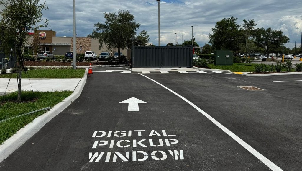 digital pickup window painted on pavement for office parking lot