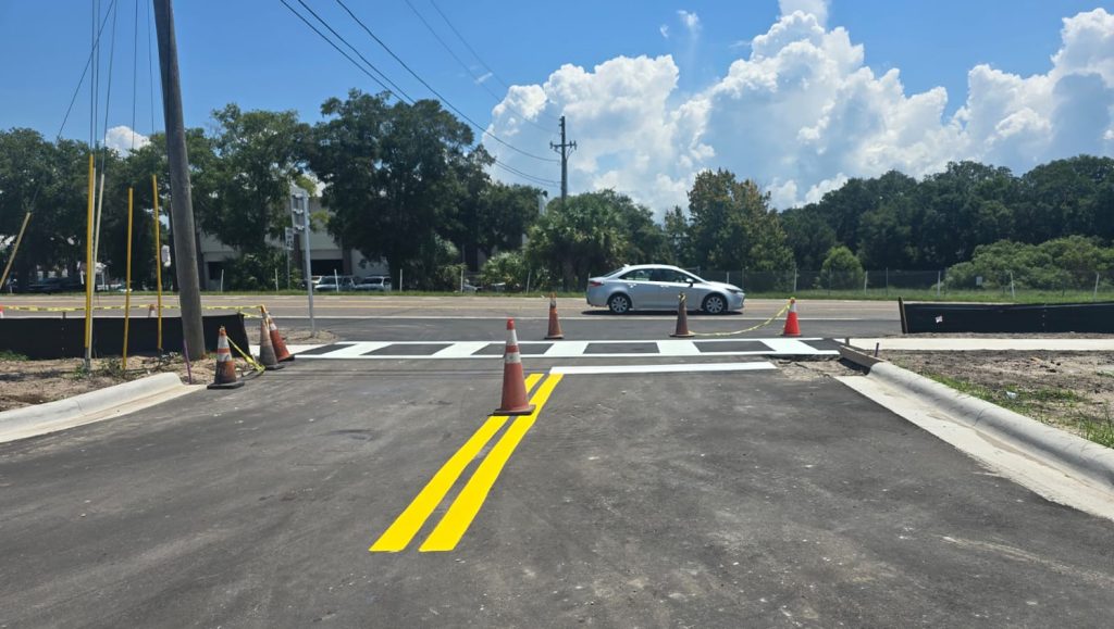 freshly painted yellow lines and arrows for parking lot