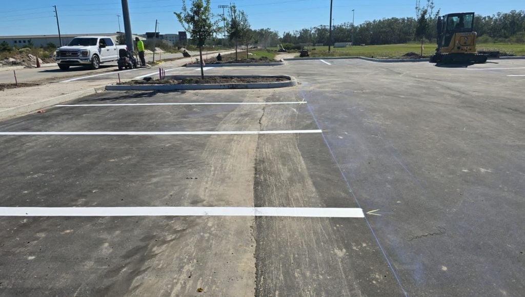 close-up of freshly painted white arrows for a park parking lot