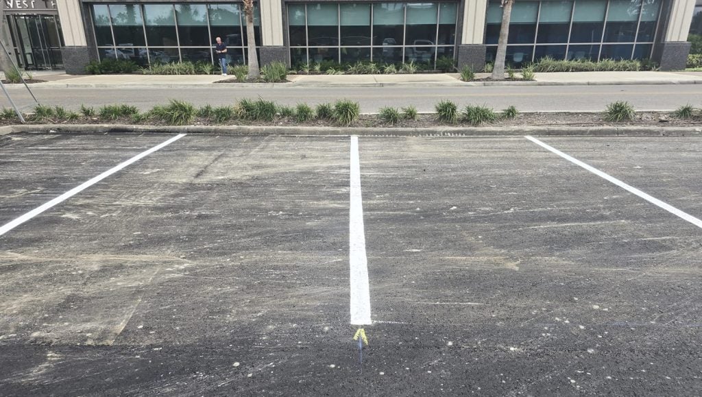 close-up of front view of freshly painted line markings for warehouse