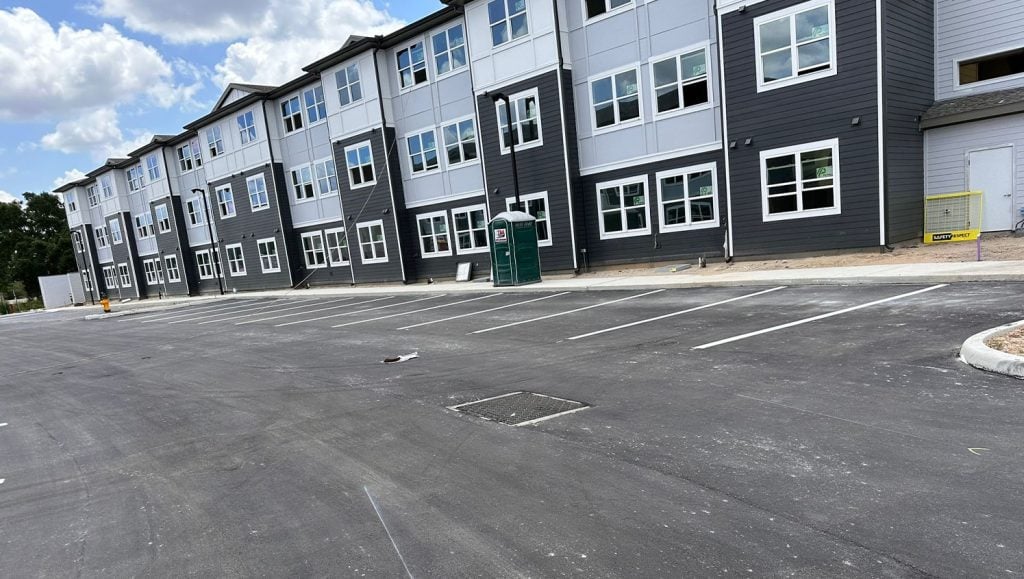 front view of freshly painted lines for apartment complex