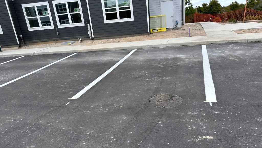 parking lot spots with fresh paint for apartment complex