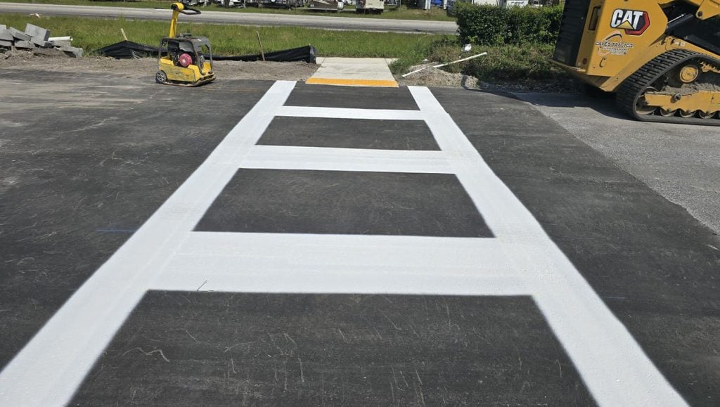 crosswalk freshly painted for business parking lot