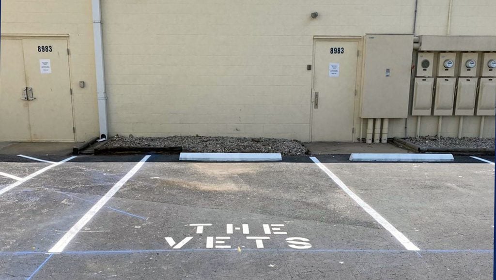 new parking lot stalls striped in back of building for an Oldsmar, FL customer