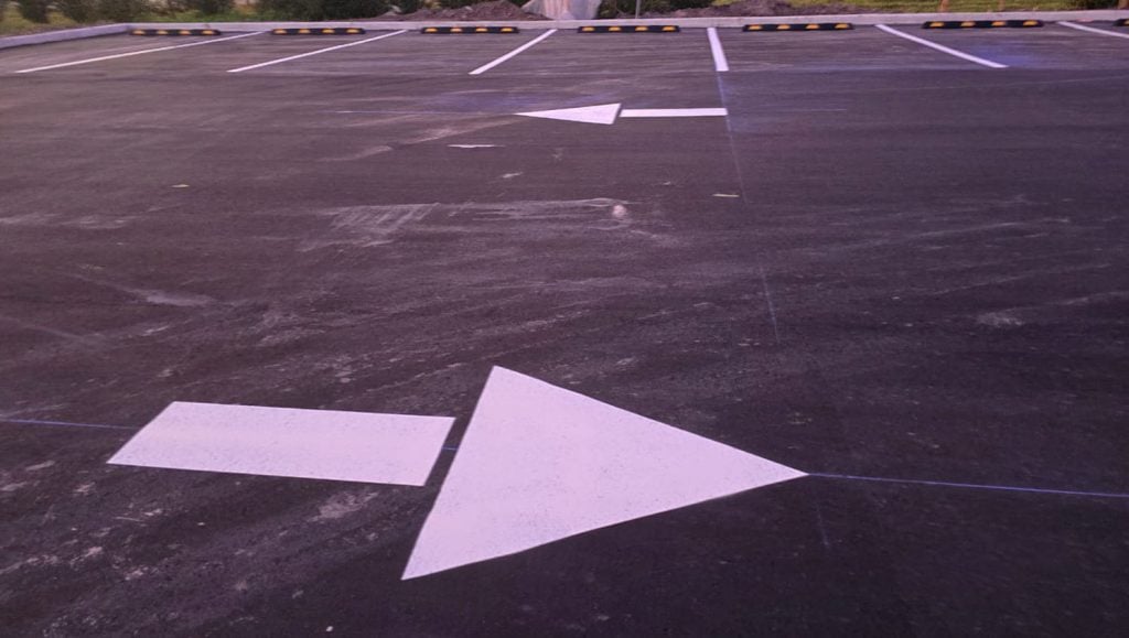 parking stops installation for business parking lot close-up