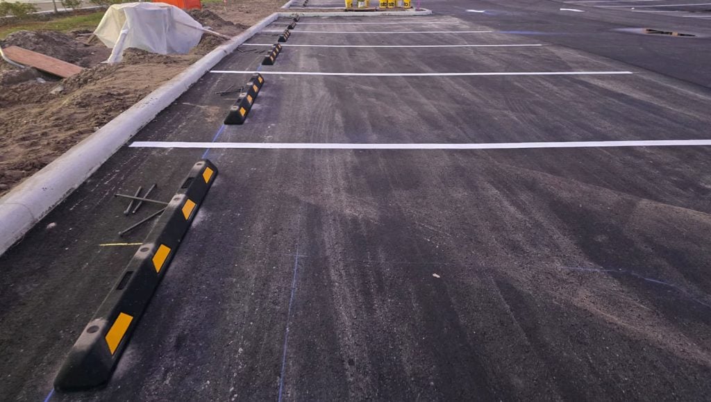 freshly painted white arrows for business parking lot